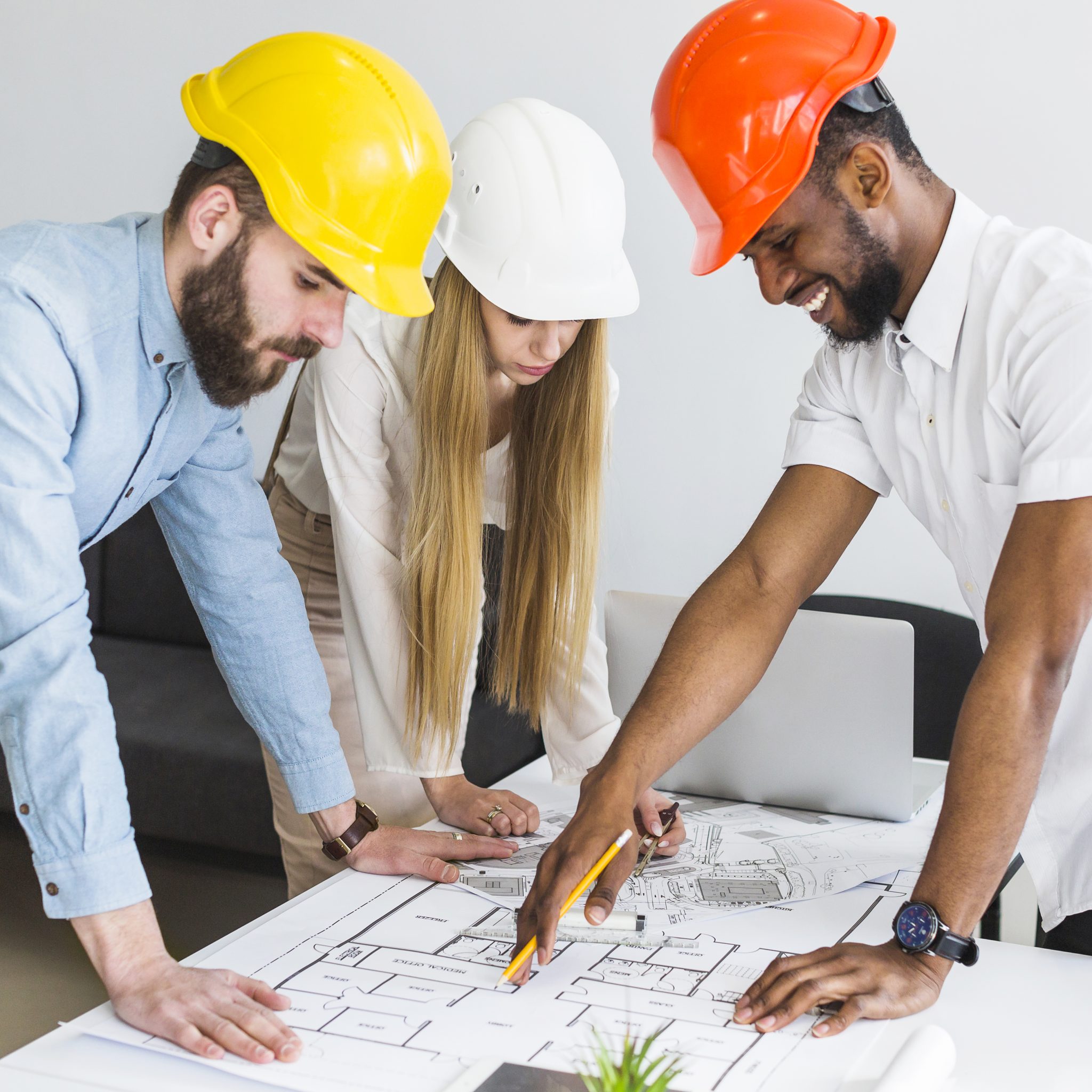 group architect discussing layout plan blueprint office scaled